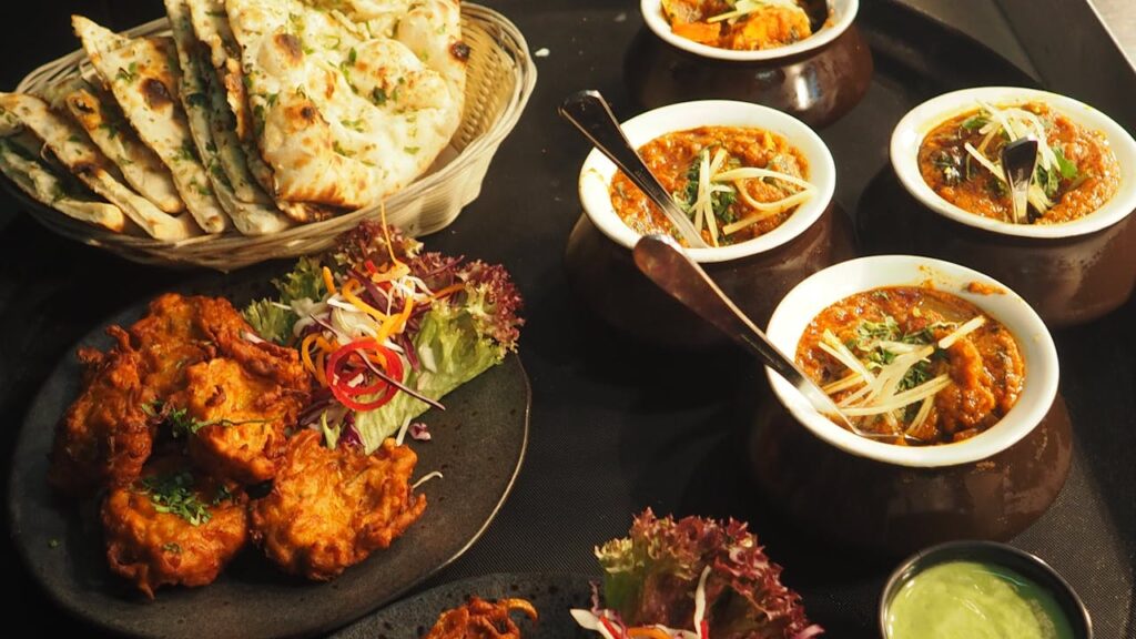 Traditional North Indian dishes displayed on a table, showcasing the rich flavors of the region's cuisine