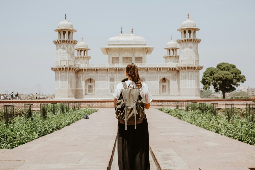Female solo traveler exploring India's vibrant streets and cultural landmarks