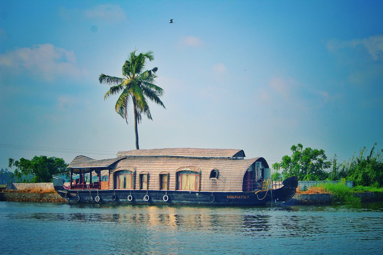 Serene houseboat cruising on calm waters, surrounded by picturesque landscapes