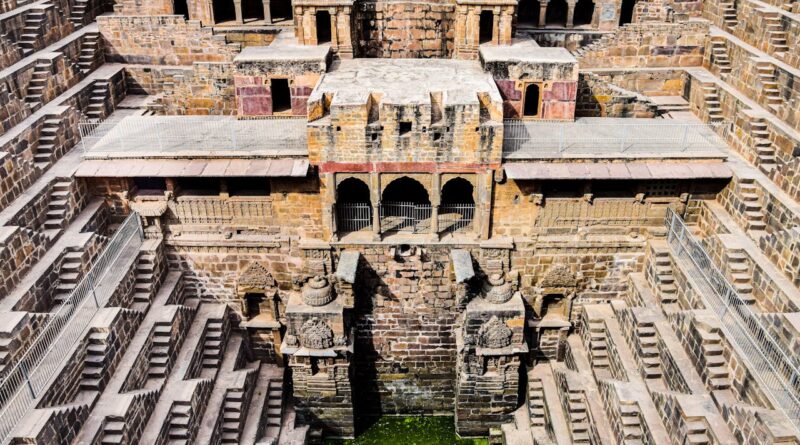 An ancient stepwell in Rajasthan, India, showcasing intricate stone carvings and architectural marvels.